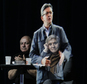 People sit at a table on stage and look towards the hologram of hard-left French presidential candidate Jean-Luc Melenchon, as he speaks to supporters who are gathered in Saint-Denis, near Paris, Sunday, Feb. 5, 2017. As Melenchon holds a rally in Lyon Sunday, a hologram of him is being projected by satellite to crowds in Paris. (AP Photo/Kamil Zihnioglu)