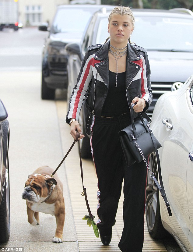 Ready to spend: Sofia Richie, 18, stepped out with her rotund bulldog Roscoe as she frequented such high end spots as Barney's New York and Fred Segal