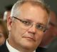 Treasurer Scott Morrison listens as Prime Minister Malcolm Turnbull addresses the National Press Club of Australia in ...