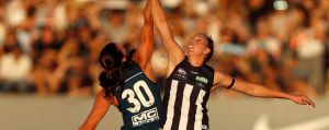 MELBOURNE, AUSTRALIA - FEBRUARY 3: Alison Downie of the Blues and Emma King of the Magpies compete in a ruck contest ...