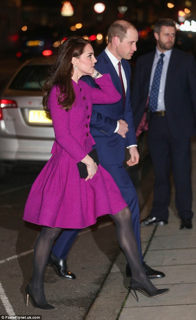 Quick change: The Duchess' purple ensemble was her second outfit on a busy day of engagements, while William appeared to be wearing the same navy suit that he wore earlier