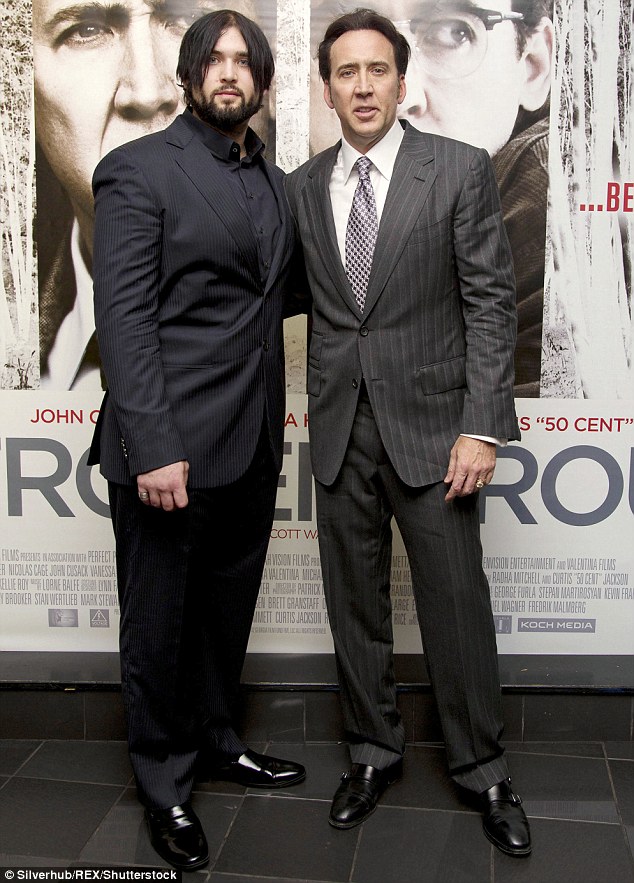 Better times: He is the son of movie star Nicolas Cage; father and son pictured at The Frozen Ground premiere in July 2013