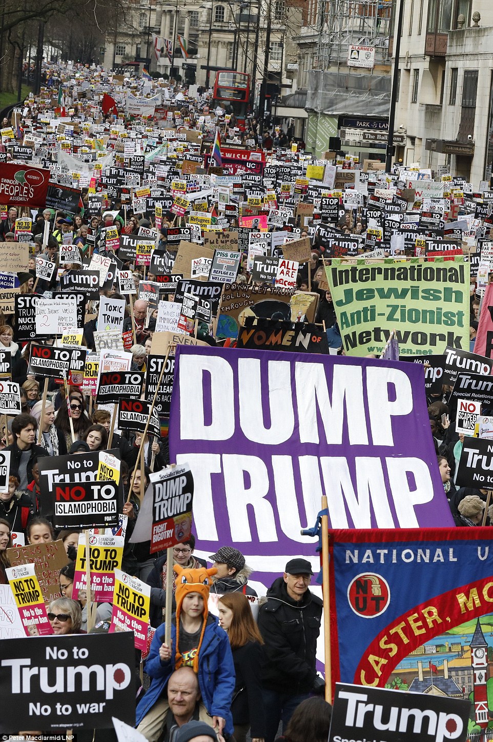 Organisers say 40,000 protesters are marching in central London to protest President Trump's travel ban and planned state visit to the UK