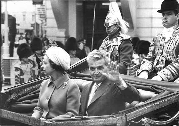 The President of Rumania, Nicolae Ceausescu, rides through London with the Queen in an open carriage, at the start of his state visit