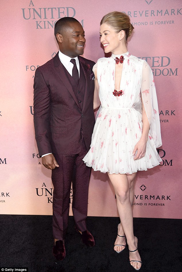 Good pals: The  actress looked every inch the English rose in the floral chiffon minidress as she posed with her beaming co-star David Oyelowo at The Paris Theatre