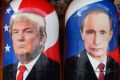 Traditional Russian wooden dolls, Matryoshka, depicting Russian President Vladimir Putin and Donald Trump.