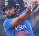 India's captain Virat Kohli plays a shot during their first Twenty20 cricket match against England at Green Park stadium ...