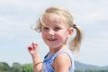 Violet Pipe, 3, enjoying a twirl at the Jerrabomberra Wetlands Open Day.