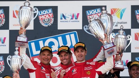 Controlled aggression: Toni Vilander, Craig Lowndes and Jamie Whincup celebrate the win.