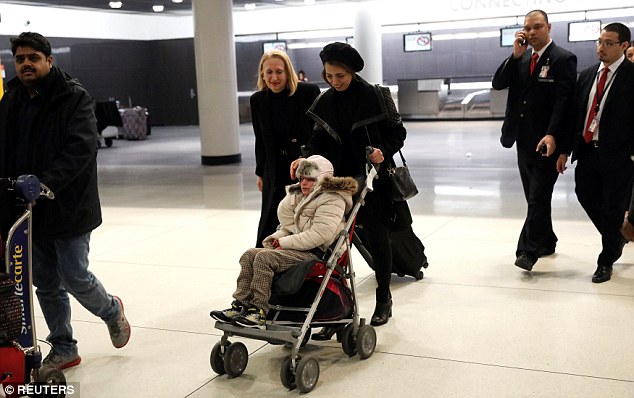 Iranian Alma Kashkooli, 12, arrived at JFK airport on Monday to get emergency eye surgery that's only available in the United States. She is pictured above being wheeled out of customs by her mother Farimeh Kashkooli