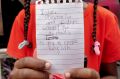 Samar, 8, an asylum seeker from Sudan at the protest outside the UNHCR in Jakarta on Monday.