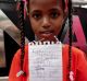 Samar, 8, an asylum seeker from Sudan at the protest outside the UNHCR in Jakarta on Monday.