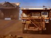 Heavy earth moving trucks at the Tom Price iron ore mine, operated by Rio Tinto Group.