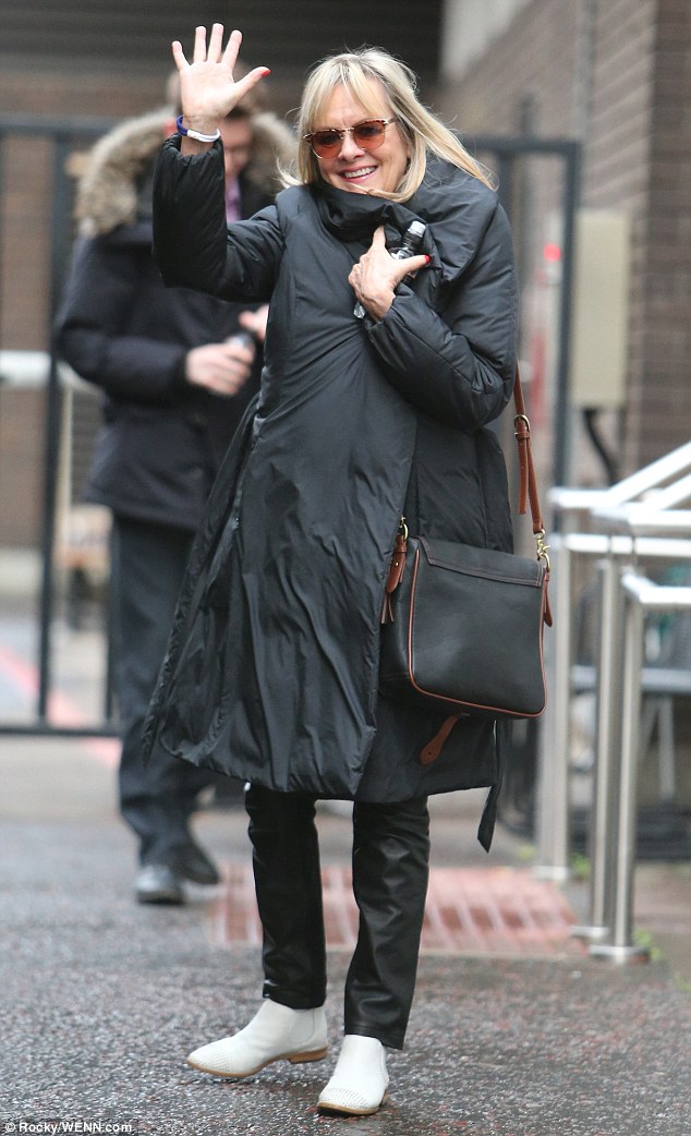 Hello there: She gave onlookers a cheerful wave as she made her way back to her waiting car