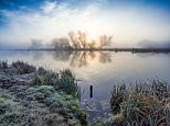 A beautiful sunrise over the River Great Ouse near Ely in Cambridgeshire on a frosty Monday morning today