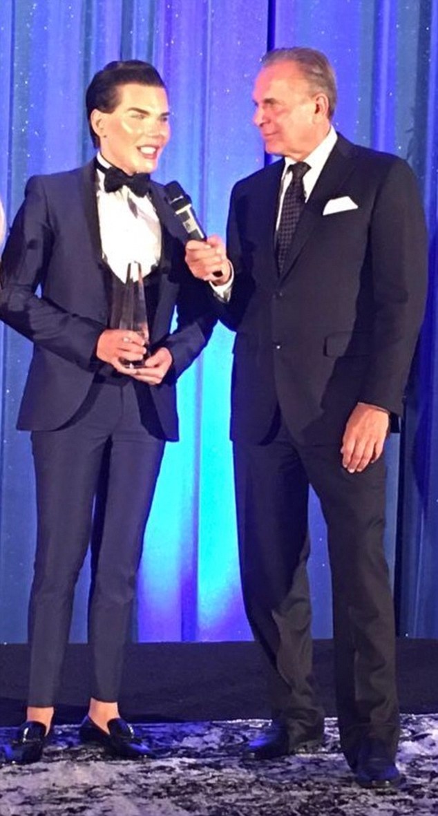 Doing his thing: Rodrigo recently received an award from CBS Doctors' star, Dr Andrew Ordon in LA for his 'power and courage to reinvent himself with the help of plastic surgery'