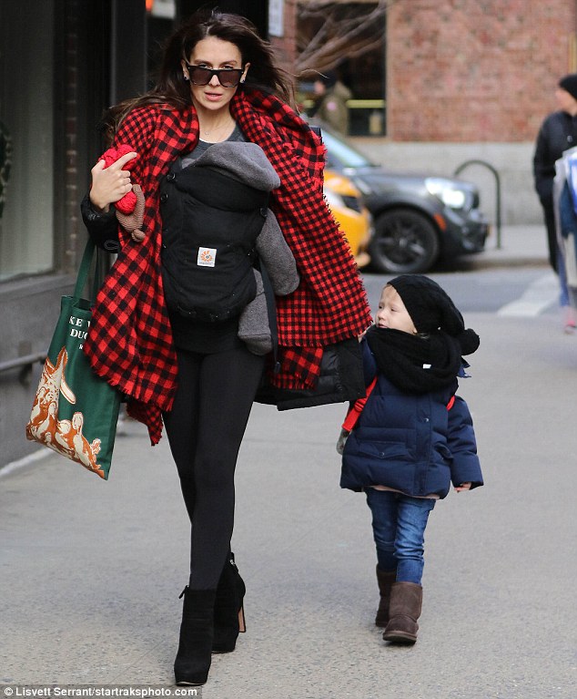 Doting mother: On Friday, Hilaria enjoyed an outing with their kids; seen in the Big Apple