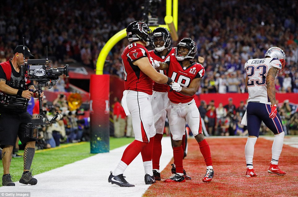 Good times: Austin Hooper #81 of the Atlanta Falcons celebrates with Taylor Gabriel #18 and Julio Jones #11 after scoring a touchdown