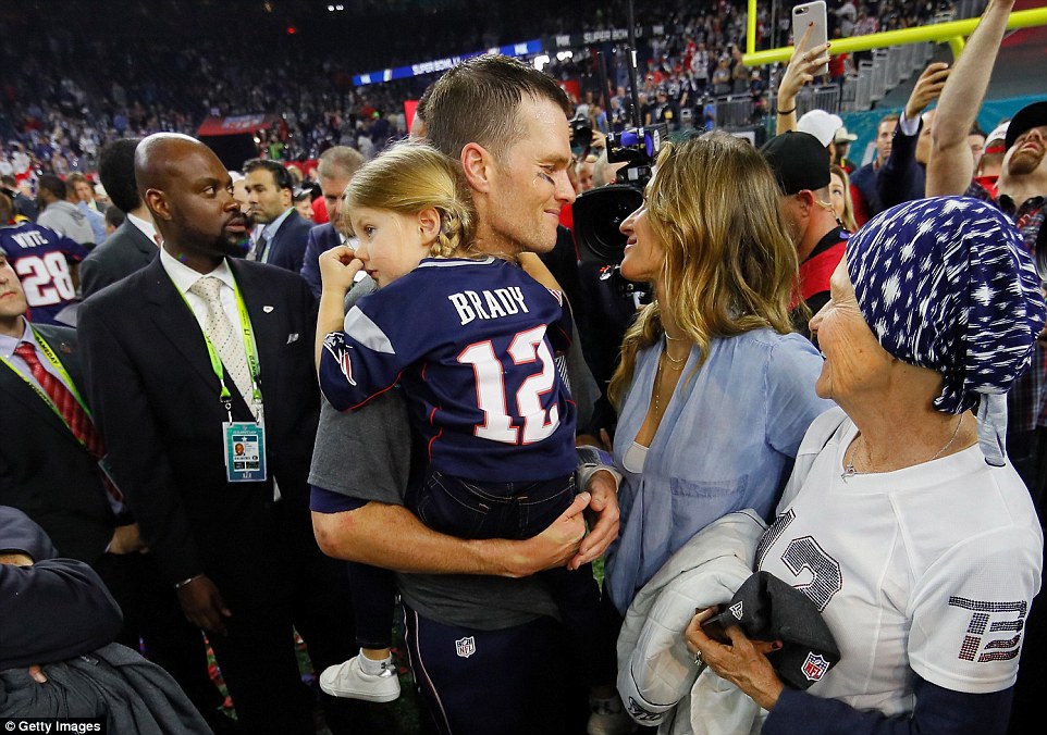 Following the game, Gisele met her husband on the field to celebrate with other families, fans and officials for the New England team