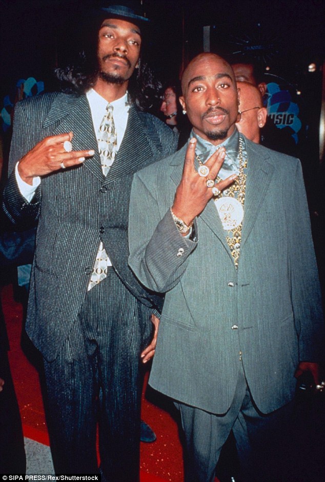 Still unsolved: Shakur died from multiple gunshots after a somewhat mysterious drive by shooting in Las Vegas in 1996 (pictured, right, with Snoop Dogg)