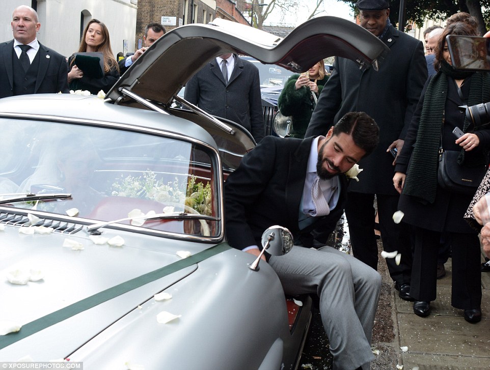 After the ceremony, Mr Lemos got into a silver Mercedes-Benz - which had gull-wing doors - and the pair drove off together