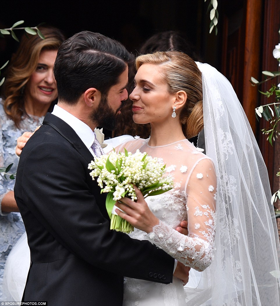 The newlyweds kissed each other after getting married inside the Orthodox Cathedral of St. Sophia near Hyde Park 