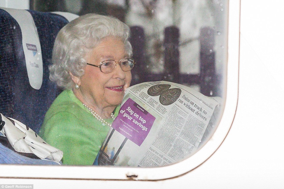 The Queen looked in good spirits in the first-class carriage as her companion read about the future of trains