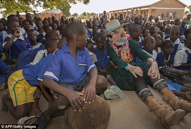 The girls are staying at an unknown location with carers while their future is decided. Village chief Kayembe said: ‘I just heard that she is nearly 60 and she has boyfriends half her age, and that her own son does not want to live with her'