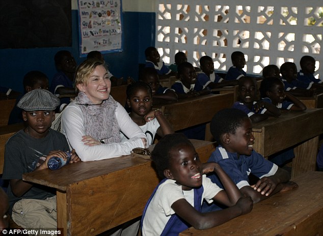 Peter Banet said signed papers in 2009 to let the 'Material Girl' hit maker adopt Mercy. He said: ‘It will be as if your children have died. That is the pain we feel every day’. Pictured, Madonna with Mercy (right) and adopted son David Banda (left) in Malawi in 2013