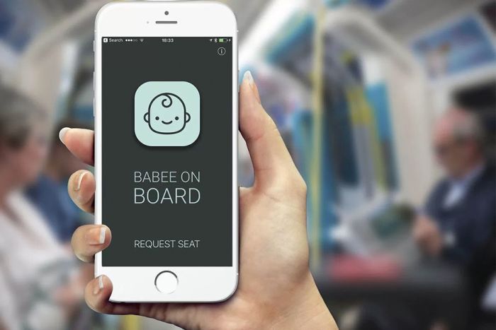 A commuter holds up her phone showing the Babee on Board app home screen.