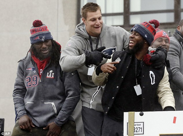 Boys: New England Patriots tight end Rob Gronkowski, center, points to running back James White alongside running back LeGarrette Blount, left, during the victory parade on Tuesday