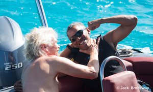 In this recent but undated photo made available by Virgin.com, former U.S President Barack Obama, jokes with Richard Branson, founder of the Virgin Group, during his stay on Moskito Island, British Virgin Islands