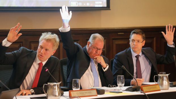 Lord mayor Robert Doyle, flanked by deputy lord mayor Arron Wood (left) and Cr Nicholas Reece, votes on the camping motion.