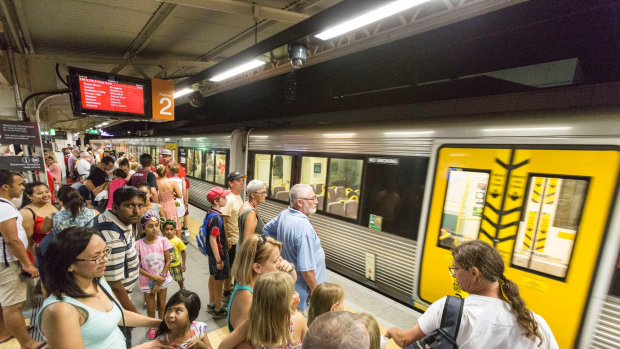 BRISBANE, AUSTRALIA - DECEMBER 31: Large crowds are seen at South Bank Station on New Year's Eve due to Queensland Rail rostering issues and drivers not coming back from holidays to drive the trains on December 31, 2016 in Brisbane, Australia. (Photo by Glenn Hunt/Fairfax Media)