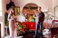 Jenny Keys and Peter Nyaryin their upstairs lounge room. A wire horse sculpture by Tom Ripon stands upon a vintage sideboard.