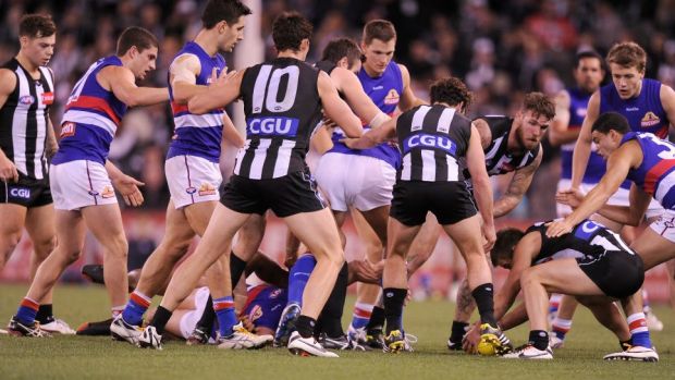 Congestion in the pack during a Collingwood-Bulldogs game last season. The AFL feels it is increasing this year.