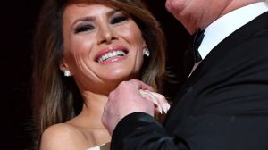 U.S. President Donald Trump sings along with the music as he dances with First Lady Melania Trump during the Liberty ...