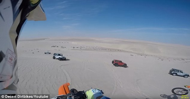 A motocyclist faced off - inadvertently - against a Jeep Wrangler in the scorching and unforgiving terrain of the Qatari desert