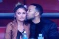 Chrissy Teigen and John Legend are having a ball at the Super Bowl.