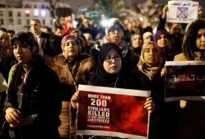 People gather during a protest to show solidarity with the residents of Aleppo and against Assad regime forces, in Casablanca