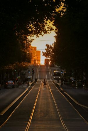 The sun shines on Collins Street.