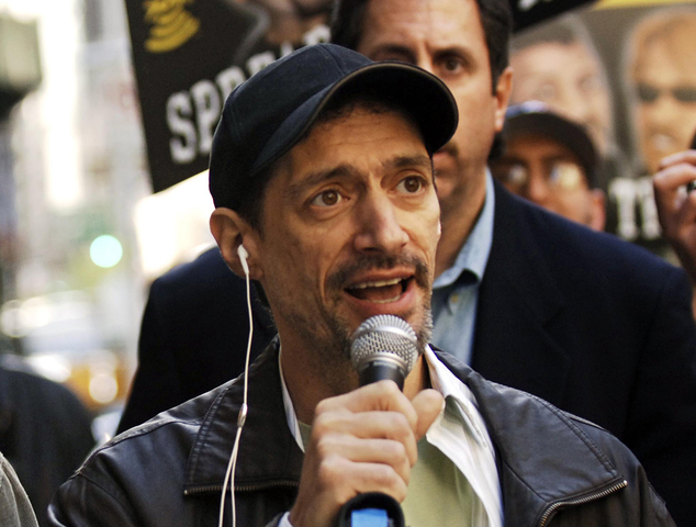 Controversy: In an April 26, 2006 file photo, radio shock jock Anthony Cumia leaves CBS Radio studios on 57th Street with fans after finishing their first morning show in New York. Cumia, a radio personality who hosted 'Opie and Anthony', is facing charges over a fight with a woman at his New York home