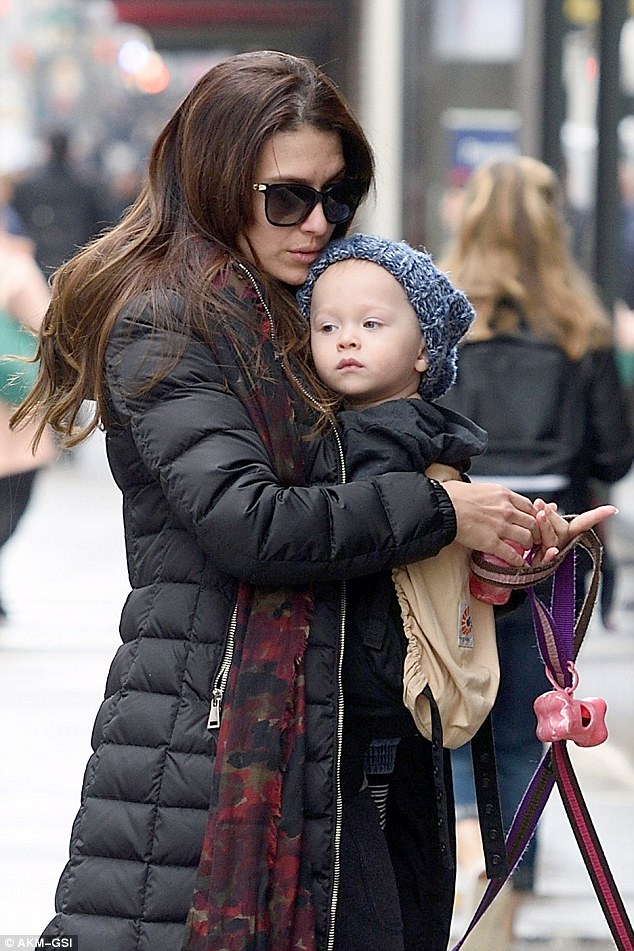 Chilling: Rafael looked adorable in his grey beanie hat as he sat in his mother's carrier while taking in the Big Apple scenery