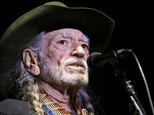 FILE - In this Jan. 7, 2017 file photo, Willie Nelson performs in Nashville, Tenn. Nelson has postponed three California shows because of illness. Publicist Elaine Schock tells The Associated Press that Nelson will have to miss his three-night stint that had been scheduled for Monday Feb. 6, 2017, Tuesday, Feb. 7, and Wednesday, Feb. 8, at Buck Owens' Crystal Palace in Bakersfield, Calif. Schock gave no details on Nelson's sickness, but says he plans to be back on the road again for a Feb. 16, concert at a San Antonio rodeo. (AP Photo/Mark Humphrey, File)