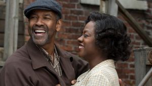 Imperfect hero: Denzel Washington as Troy, the trash man who is a tyrant in his own castle, with Viola Davis as his ...
