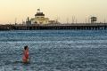 Cooling down at St Kilda beach after another hot Melbourne night.