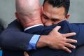 Phillip Pama embraces his lawyer outside the District Court in Brisbane after being found not guilty of manslaughter.