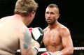 Quade Cooper and Jack McInnes fight during their heavyweight bout at Adelaide Oval.