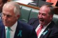 Deputy Prime Minister Barnaby Joyce laughs as Prime Minister Malcolm Turnbull attacks Opposition Leader Bill Shorten.