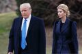 President Donald Trump and his daughter Ivanka walk to board Marine One on the South Lawn of the White House in Washington.